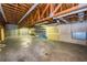 A spacious garage is well lit, has shelving and plenty of room for vehicles or storage at 5425 Lewellyn Rd, Lakeland, FL 33810