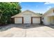 Three-car garage with brick accents at 5425 Lewellyn Rd, Lakeland, FL 33810