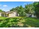 View of the detached garage and shed in the backyard at 5425 Lewellyn Rd, Lakeland, FL 33810