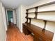 Hallway with desk and shelves, offering practical storage and a dedicated workspace at 5425 Lewellyn Rd, Lakeland, FL 33810