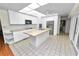 Bright kitchen with white cabinets, butcher block counters, and stainless steel appliances offers a modern design at 5425 Lewellyn Rd, Lakeland, FL 33810