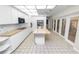 Bright kitchen with white cabinets, butcher block counters, and stainless steel appliances offers a modern design at 5425 Lewellyn Rd, Lakeland, FL 33810