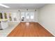 Bright and airy living room featuring wood floors and glass doors leading to the outside at 5425 Lewellyn Rd, Lakeland, FL 33810