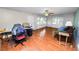 This living room features hardwood floors, an overhead fan, natural light, neutral paint, and plenty of space at 5425 Lewellyn Rd, Lakeland, FL 33810