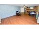 This spacious living room boasts a brick fireplace, hardwood floors, an accent wall, and ample natural light at 5425 Lewellyn Rd, Lakeland, FL 33810