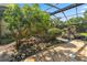 A pool area features lush vegetation and a unique rock feature at 5425 Lewellyn Rd, Lakeland, FL 33810