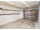 The ample storage room has built in shelves, concrete block walls and a bright overhead light at 5425 Lewellyn Rd, Lakeland, FL 33810