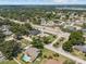 A tranquil neighborhood featuring a beautiful home with a swimming pool surrounded by lush greenery at 5519 Club W Hl, Lakeland, FL 33812