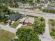 An aerial view of the house and its surroundings, showcasing the neighborhood and nearby pool at 5519 Club W Hl, Lakeland, FL 33812