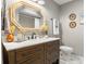 Stylish bathroom vanity with decorative mirror and elegant fixtures at 5519 Club W Hl, Lakeland, FL 33812