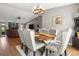 A dining room featuring a wood table, upholstered chairs, and a decorative chandelier at 5519 Club W Hl, Lakeland, FL 33812