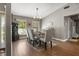 Dining area featuring an elegant table set, complementary decor, and natural lighting at 5519 Club W Hl, Lakeland, FL 33812