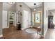 A welcoming foyer with hardwood floors, a front door with glass inserts, and neutral decor at 5519 Club W Hl, Lakeland, FL 33812