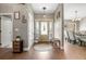 Inviting foyer featuring a decorative rug, charming bench, and view into the dining room at 5519 Club W Hl, Lakeland, FL 33812