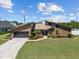Charming home with landscaped front yard, driveway, and inviting entrance at 5519 Club W Hl, Lakeland, FL 33812