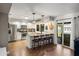 Open kitchen with island, stainless steel appliances, and stylish bar stools at 5519 Club W Hl, Lakeland, FL 33812