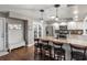 Bright kitchen featuring granite countertops, stainless steel appliances and a cozy breakfast bar with seating at 5519 Club W Hl, Lakeland, FL 33812