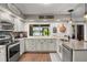 Updated kitchen with granite countertops, stainless steel appliances, recessed lighting, and bright open space at 5519 Club W Hl, Lakeland, FL 33812