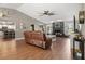 Cozy living room boasts a dark stone fireplace and warm brown leather furniture at 5519 Club W Hl, Lakeland, FL 33812