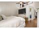 Main bedroom featuring high ceilings, a large TV, and an organized closet space at 5519 Club W Hl, Lakeland, FL 33812