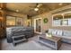 Screened patio with a hot tub, comfortable seating, and a ceiling fan for relaxing and entertaining at 5519 Club W Hl, Lakeland, FL 33812