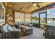 Screened patio with comfortable seating, stylish decor, and a ceiling fan, ideal for relaxing and entertaining at 5519 Club W Hl, Lakeland, FL 33812