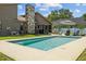 Beautiful backyard featuring a sparkling pool, stone fireplace, and an outdoor dining area perfect for outdoor relaxation and entertaining at 5519 Club W Hl, Lakeland, FL 33812