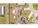 Aerial view of a private home and backyard including a circular pool and patio area at 555 Heather Glen Dr, Winter Haven, FL 33884