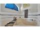 Soaking tub features stylish tile and window for natural light at 555 Heather Glen Dr, Winter Haven, FL 33884