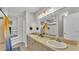 Bright bathroom with double sinks, large mirror, and plenty of cabinet space at 555 Heather Glen Dr, Winter Haven, FL 33884