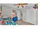 Bright bedroom featuring a ceiling fan, closet, and colorful Minecraft-themed bedding at 555 Heather Glen Dr, Winter Haven, FL 33884