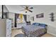 Cozy bedroom with ceiling fan, dresser, and ample natural light from the windows at 555 Heather Glen Dr, Winter Haven, FL 33884