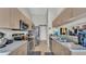 Well-lit kitchen with stainless steel appliances and ample counter space for cooking at 555 Heather Glen Dr, Winter Haven, FL 33884