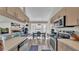 Modern kitchen leading to dining area with stainless steel appliances and ample counter space at 555 Heather Glen Dr, Winter Haven, FL 33884