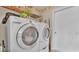 A dedicated laundry room with a full-size washer and dryer for convenience at 555 Heather Glen Dr, Winter Haven, FL 33884