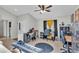Bright room with tile floors, ceiling fan, and multiple desks at 555 Heather Glen Dr, Winter Haven, FL 33884
