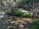 Lush backyard with storage shed, trees and foliage at 5624 Laurel Oak Dr, Lakeland, FL 33811