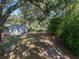 Lush backyard featuring mature trees and foliage offer a secluded and tranquil outdoor space at 5624 Laurel Oak Dr, Lakeland, FL 33811