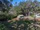 Backyard with storage shed and mature trees at 5624 Laurel Oak Dr, Lakeland, FL 33811