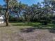 Expansive backyard with mature trees providing shade and privacy at 5624 Laurel Oak Dr, Lakeland, FL 33811