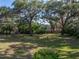 Large backyard featuring mature trees offering ample shade and a private atmosphere at 5624 Laurel Oak Dr, Lakeland, FL 33811