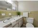 Well-lit bathroom featuring a single sink vanity with tiled backsplash and a large mirror at 5624 Laurel Oak Dr, Lakeland, FL 33811