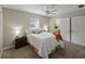 Serene bedroom with natural light, plush bedding, and a convenient nightstand at 5624 Laurel Oak Dr, Lakeland, FL 33811