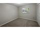 Bedroom with carpet floors, neutral wall paint, a window and closet space at 5624 Laurel Oak Dr, Lakeland, FL 33811