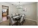 Well-lit dining area with a table for six and views into the kitchen at 5624 Laurel Oak Dr, Lakeland, FL 33811