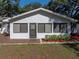 Charming single-story home with a brick walkway, manicured landscaping, and a welcoming front entrance at 5624 Laurel Oak Dr, Lakeland, FL 33811