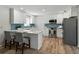 Charming kitchen with a center island, stainless steel appliances, and breakfast bar seating at 5624 Laurel Oak Dr, Lakeland, FL 33811