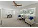 Spacious living room with elegant seating, large windows, and views of the outdoors at 5624 Laurel Oak Dr, Lakeland, FL 33811
