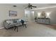Comfortable living room featuring a gray sofa, glass coffee table and neutral decor at 5624 Laurel Oak Dr, Lakeland, FL 33811