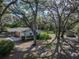 Aerial view of a well-maintained house with large backyard and storage shed at 5624 Laurel Oak Dr, Lakeland, FL 33811